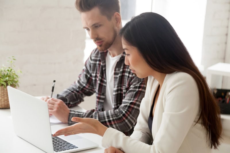 AC Maintenance Checklist. Couple at computer.